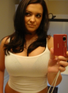 Brooke loves to take pictures of her huge tits almost falling out of her bikini top Picture 9